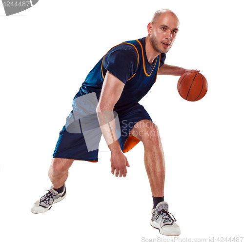 Image of Full length portrait of a basketball player with ball