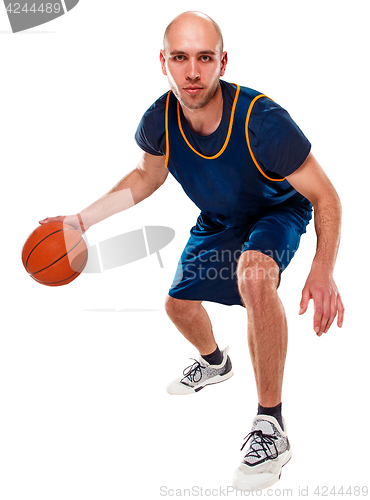 Image of Full length portrait of a basketball player with ball