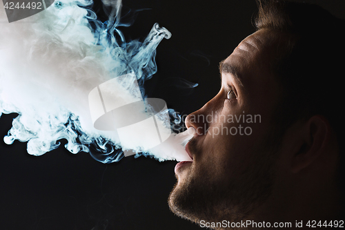 Image of The face of vaping young man