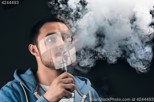 Image of The face of vaping young man