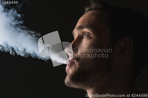 Image of The face of vaping young man