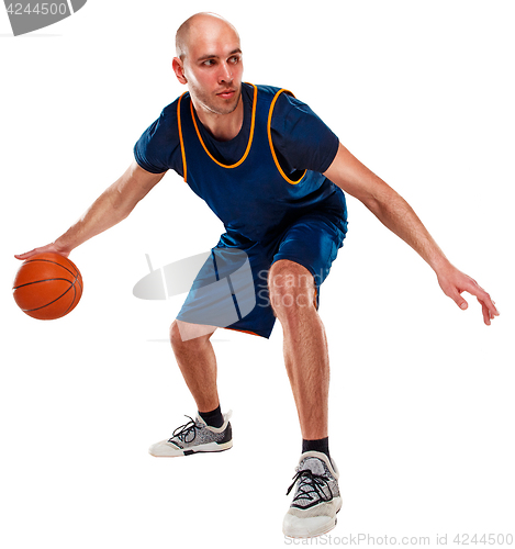 Image of Full length portrait of a basketball player with ball