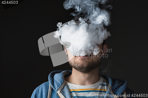 Image of The face of vaping young man