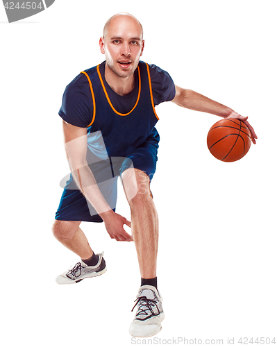 Image of Full length portrait of a basketball player with ball