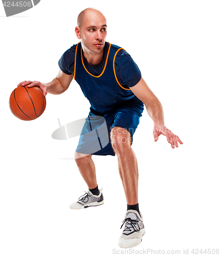 Image of Full length portrait of a basketball player with ball