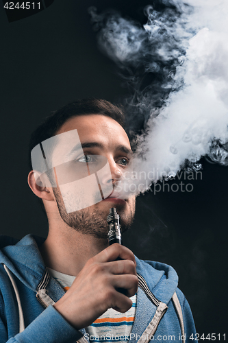 Image of The face of vaping young man