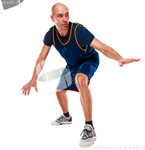 Image of Full length portrait of a basketball player with ball