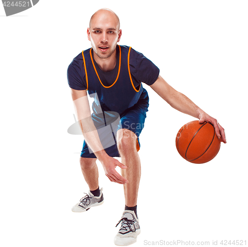 Image of Full length portrait of a basketball player with ball