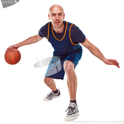 Image of Full length portrait of a basketball player with ball