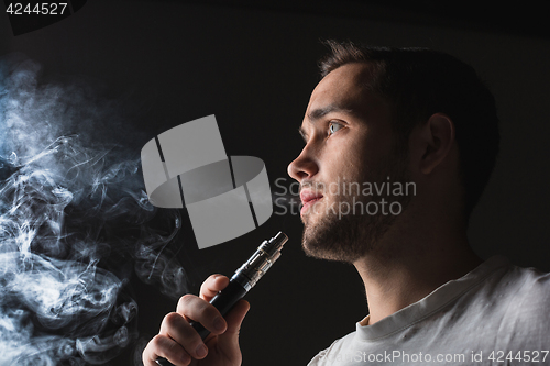 Image of The face of vaping young man