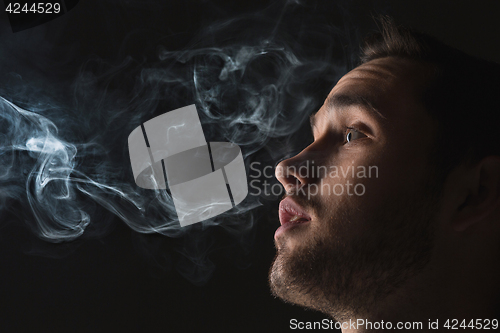 Image of The face of vaping young man