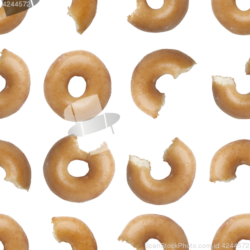 Image of Seamless pattern of bites taken off a donut