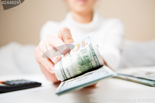 Image of Hands counting money, close up