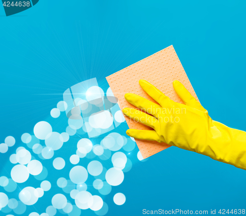 Image of Man wiping window with rag