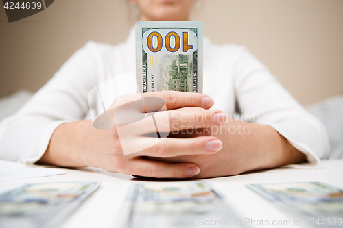 Image of Woman hands holding money