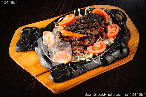 Image of Beef steak with red beans garnish