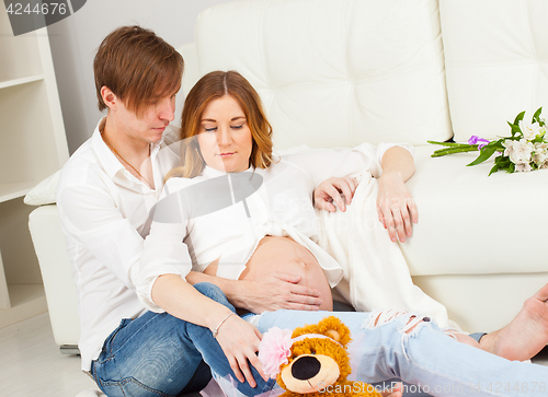 Image of Young man and pregnant woman waiting for a newborn