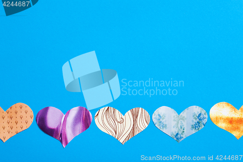 Image of multicolored hearts on a blue background