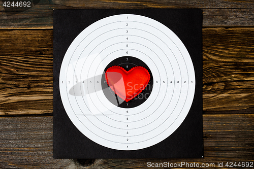 Image of red heart on shooting target
