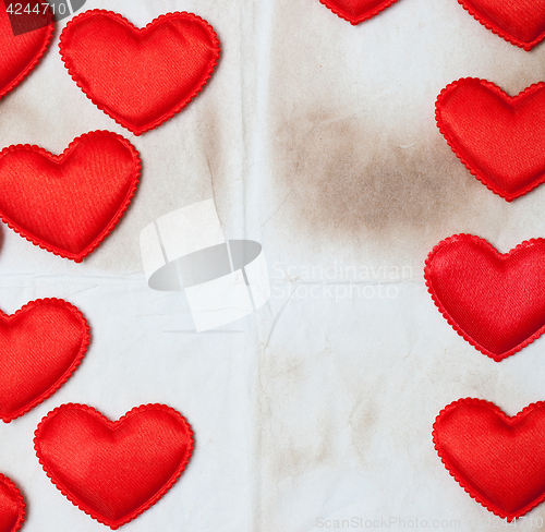 Image of old paper background with red hearts