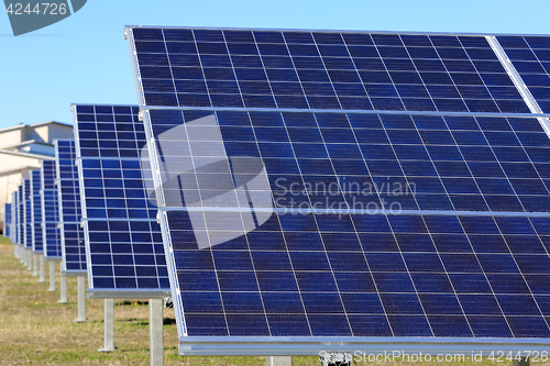 Image of Row of Solar panels on a Field
