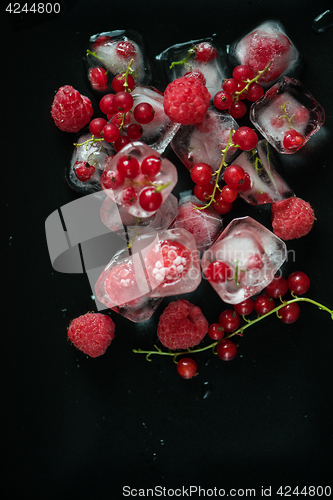 Image of Frozen berries on wooden table