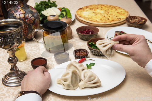 Image of Man eating in georgian restaurant