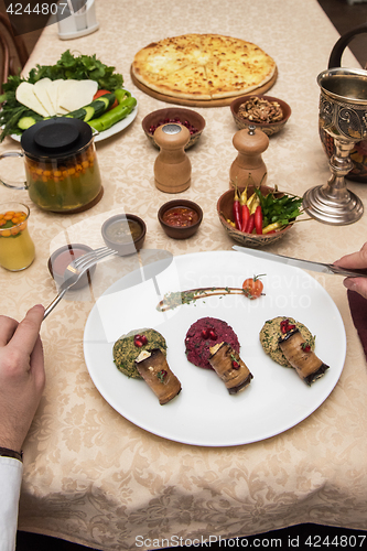 Image of Man eating in georgian restaurant