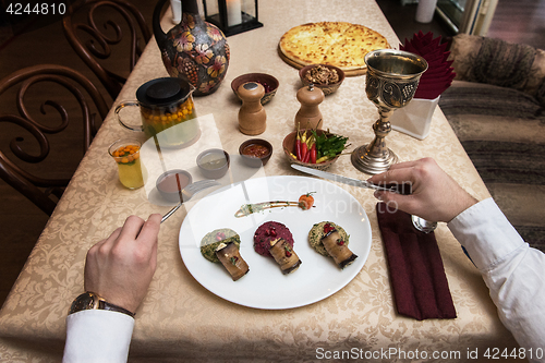 Image of Man eating in georgian restaurant