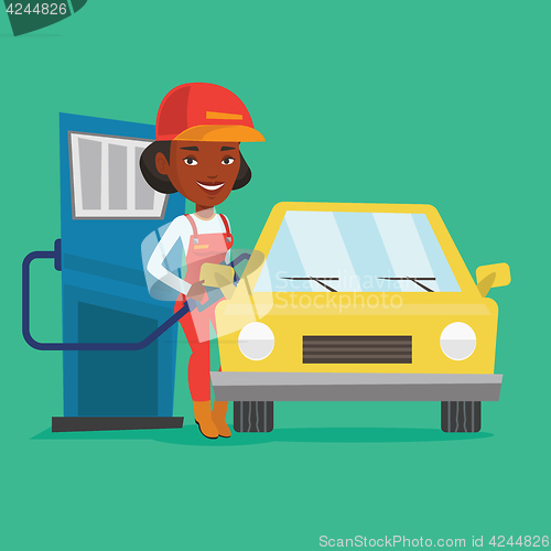 Image of Worker filling up fuel into car.