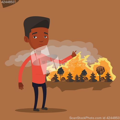 Image of Man standing on background of wildfire.