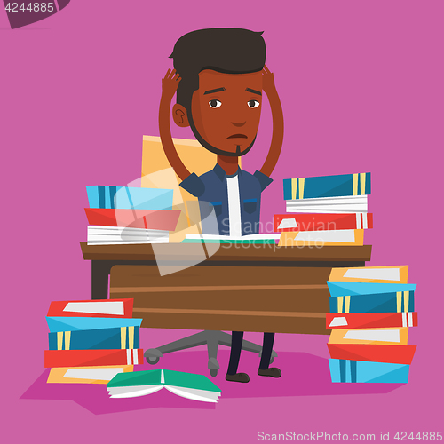 Image of Student sitting at the table with piles of books.