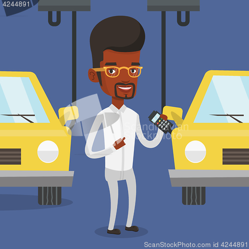 Image of Worker controlling automated assembly line for car