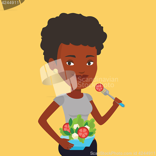 Image of Woman eating healthy vegetable salad.