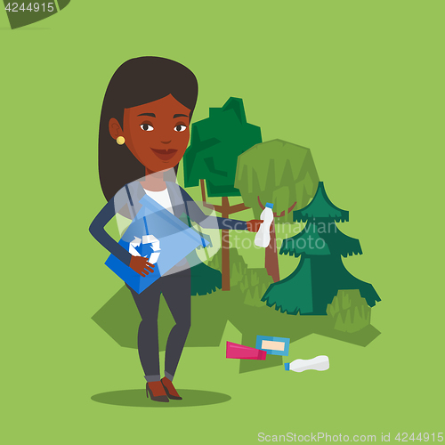 Image of Woman collecting garbage in forest.