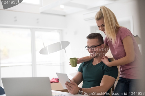 Image of Young couple moving in a new home