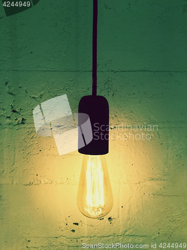 Image of Simple light bulb on a black cord