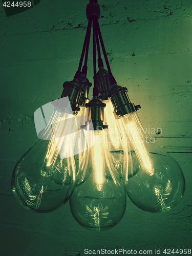 Image of Bunch of light bulbs giving green light