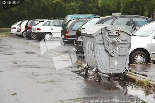 Image of Garbage Containers in the Rain