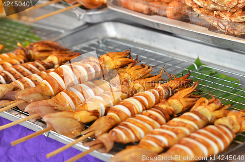 Image of Grilled bbq squids on sticks