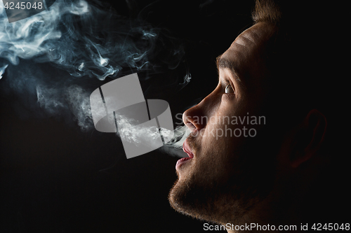 Image of The face of vaping young man