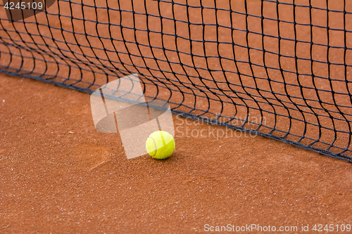 Image of Tennis court with tennis ball and net