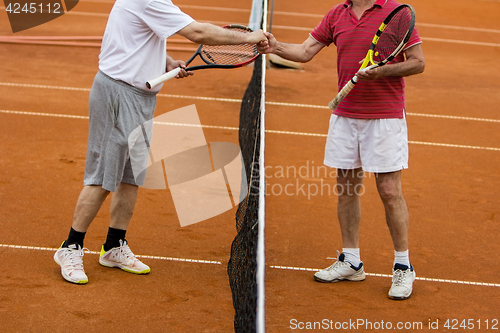 Image of Tennis players shake hands after the tennis match