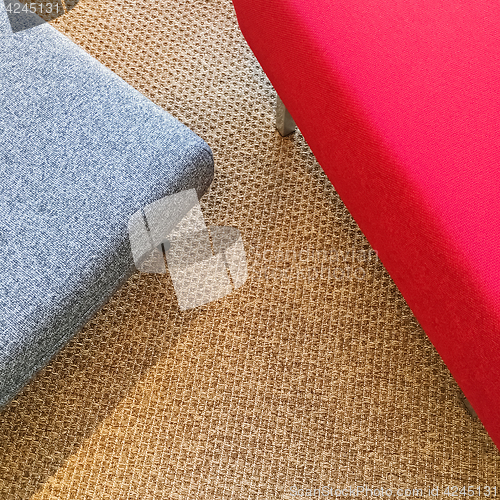 Image of Red and gray seats on carpet floor