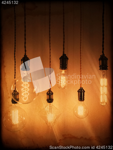Image of Illuminated light bulbs on a vintage background