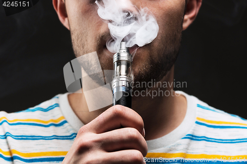 Image of The face of vaping young man