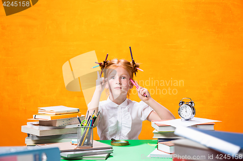 Image of Teen girl with lot of books