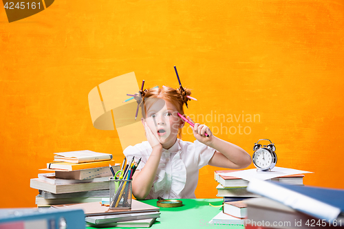 Image of Teen girl with lot of books