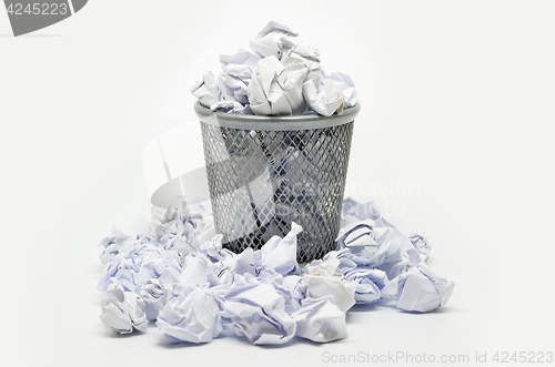 Image of Garbage bin with paper waste