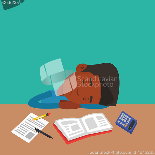 Image of Male student sleeping at the desk with book.